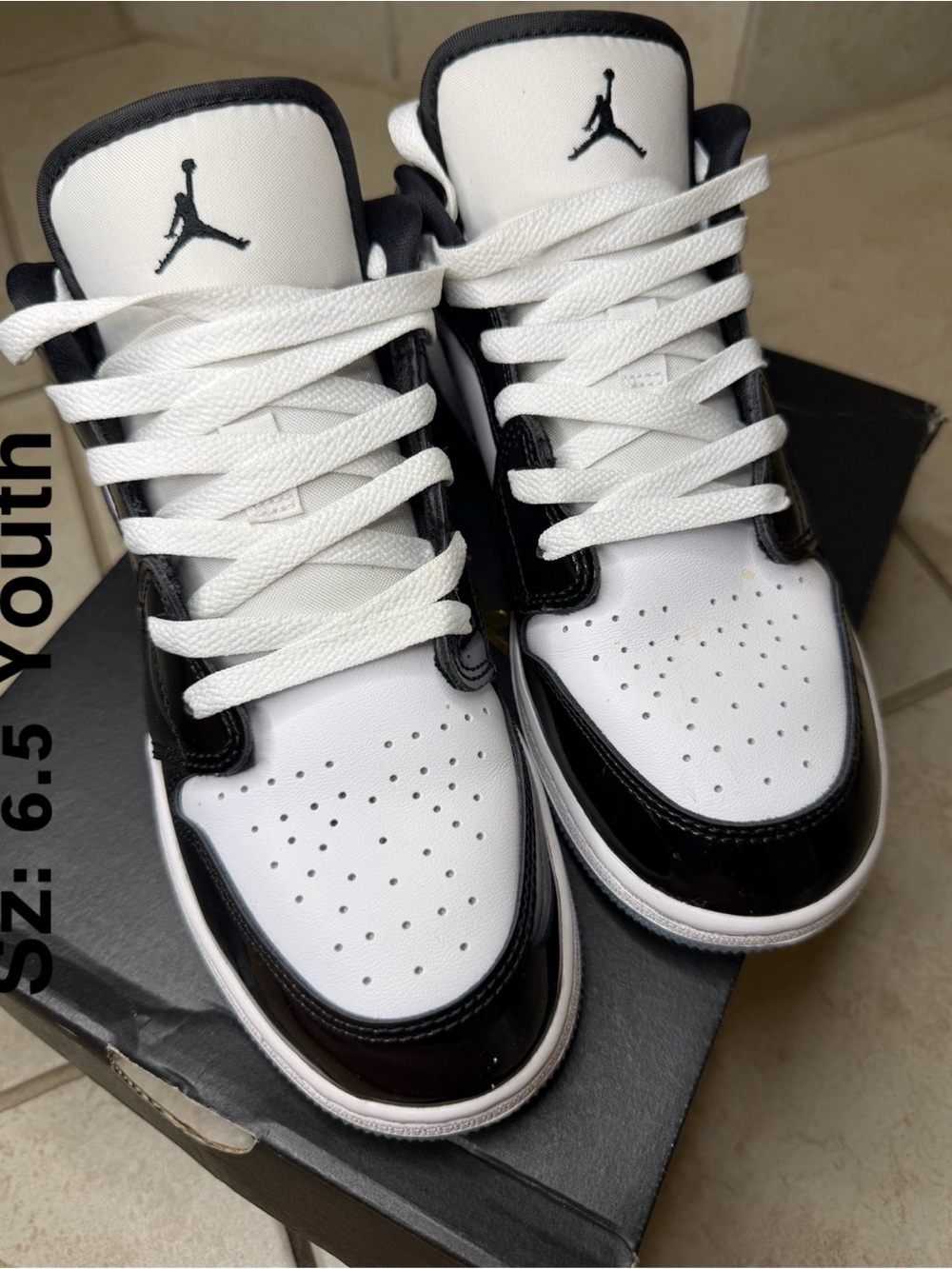 Jordan Youth Black and White High-Top Sneakers